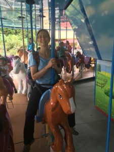 Sonia Steinway on a carousel