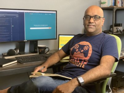 Nishal Mohan working at his desk